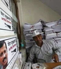 A volunteer from the newly formed Aam Aadmi (Common Man) Party sits inside the party's office in New Delhi